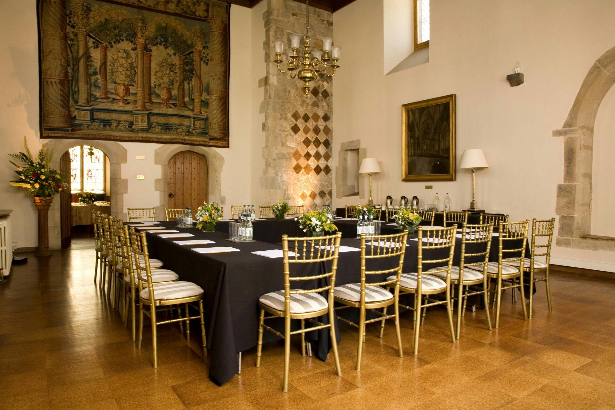 Cheneygates in Westminster Abbey: elegant corporate meeting space with floral centerpieces.